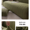 Olive green knitted sofa slipcover displayed on a couch with natural light.