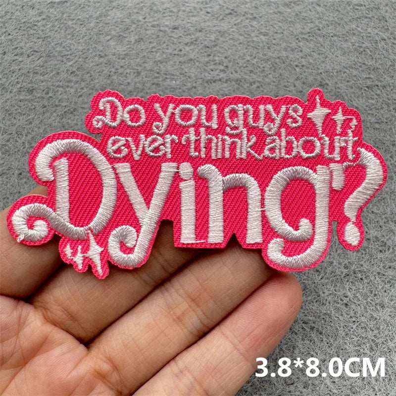 Pink embroidered patch with the text Do you guys ever think about Dying
