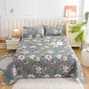 Light green floral print flat bed sheets displayed on a bed with white wooden furniture and a potted plant.