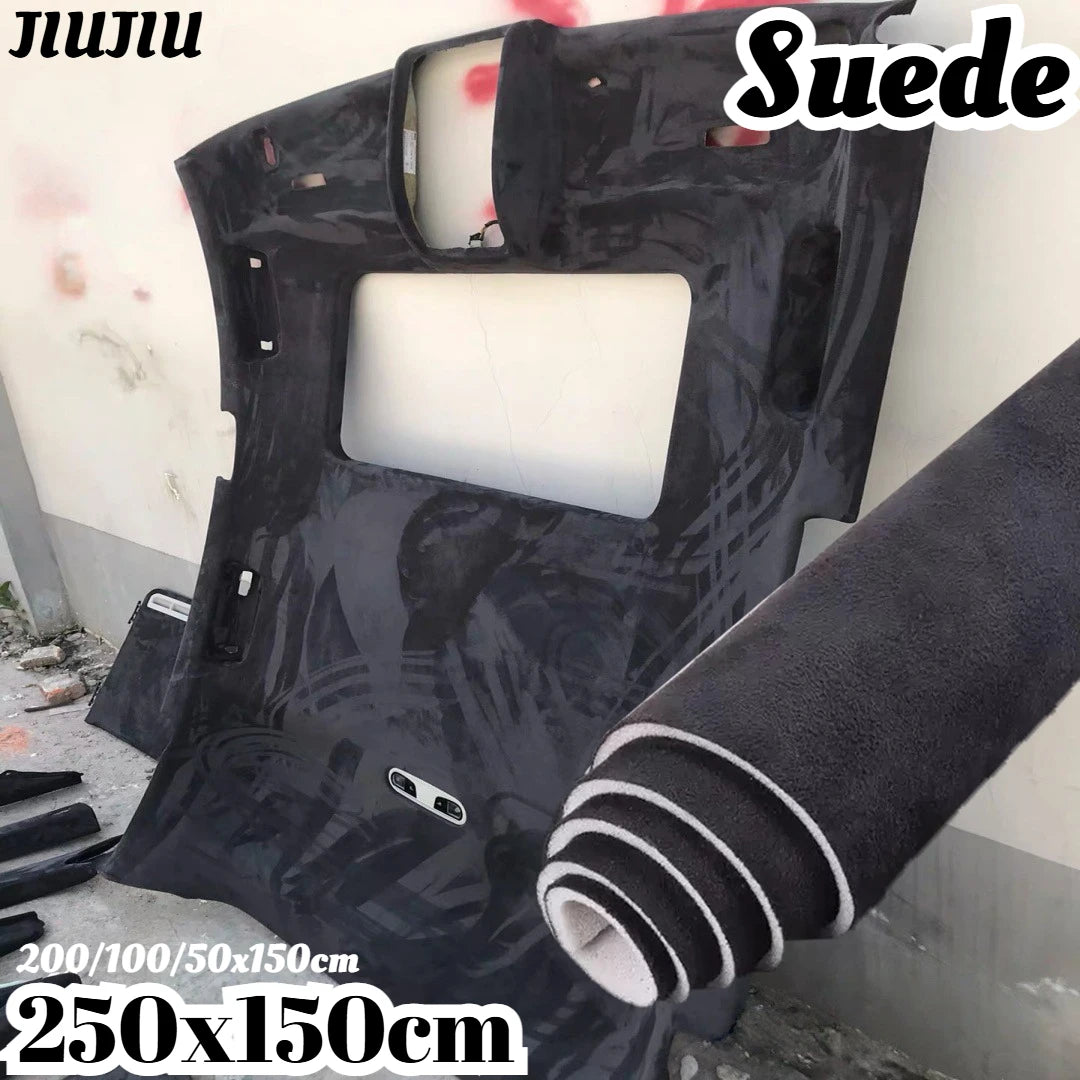Black suede auto headliner fabric roll with foam backing shown against a white wall.