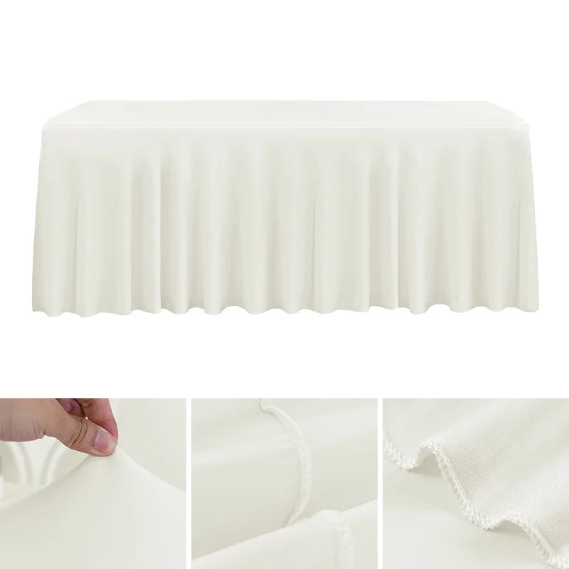 A white stretchable waterproof rectangle tablecloth draped over a table.