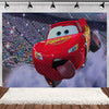 A red cartoon race car flying against a blue sky backdrop for a birthday party.