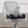 A white ergonomic memory foam seat cushion is shown on a rolling chair, ready for use in a car or office.