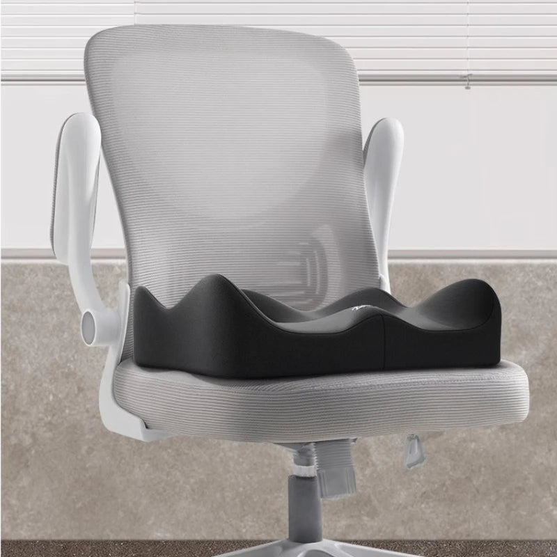 A white ergonomic memory foam seat cushion is shown on a rolling chair, ready for use in a car or office.