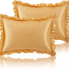 A set of two ruffled satin pillowcases in a golden beige color with silky envelope closures.