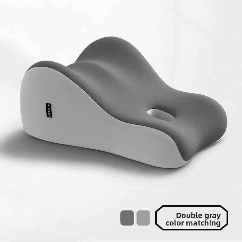A single gray memory foam wedge pillow shown from the side with a small logo visible.