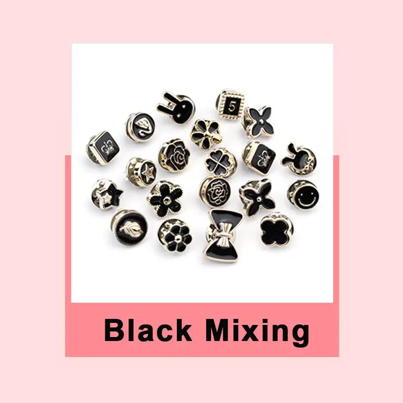 A collection of black mixing instant removable pearl brooch buttons arranged on a white background.