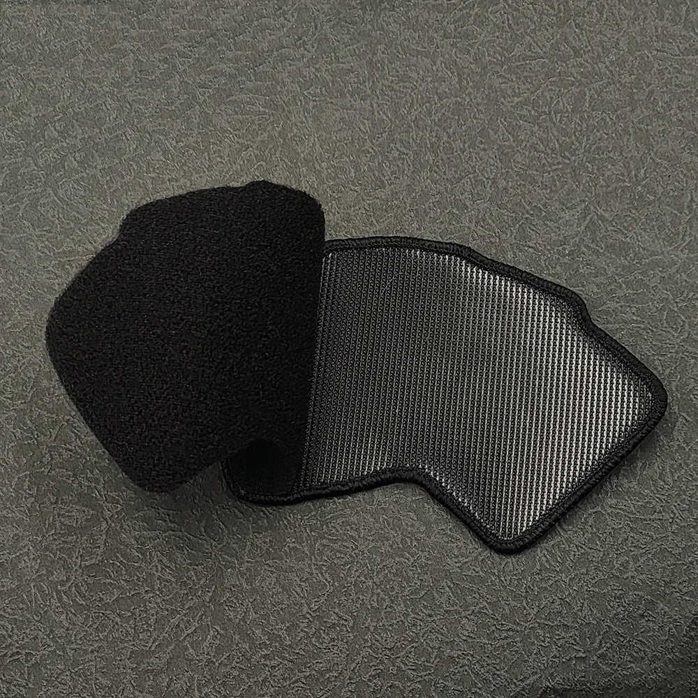 Black tactical poker card hook and loop embroidered patch lying on a dark surface.