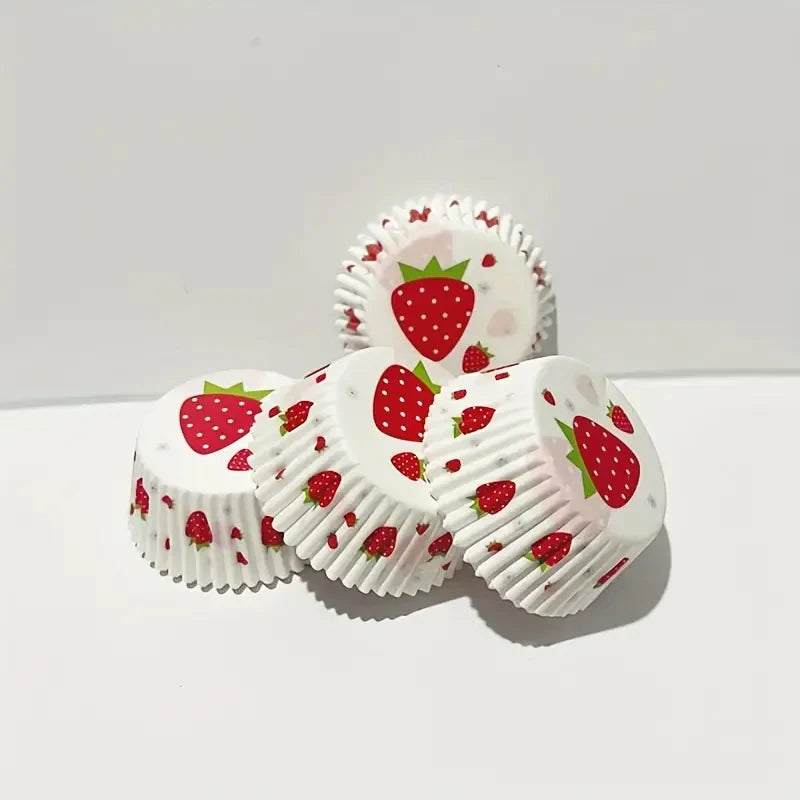 A display of white oil-proof baking cups decorated with red strawberry patterns.