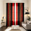 Modern leopard print curtains in black and red hang in a living room window.