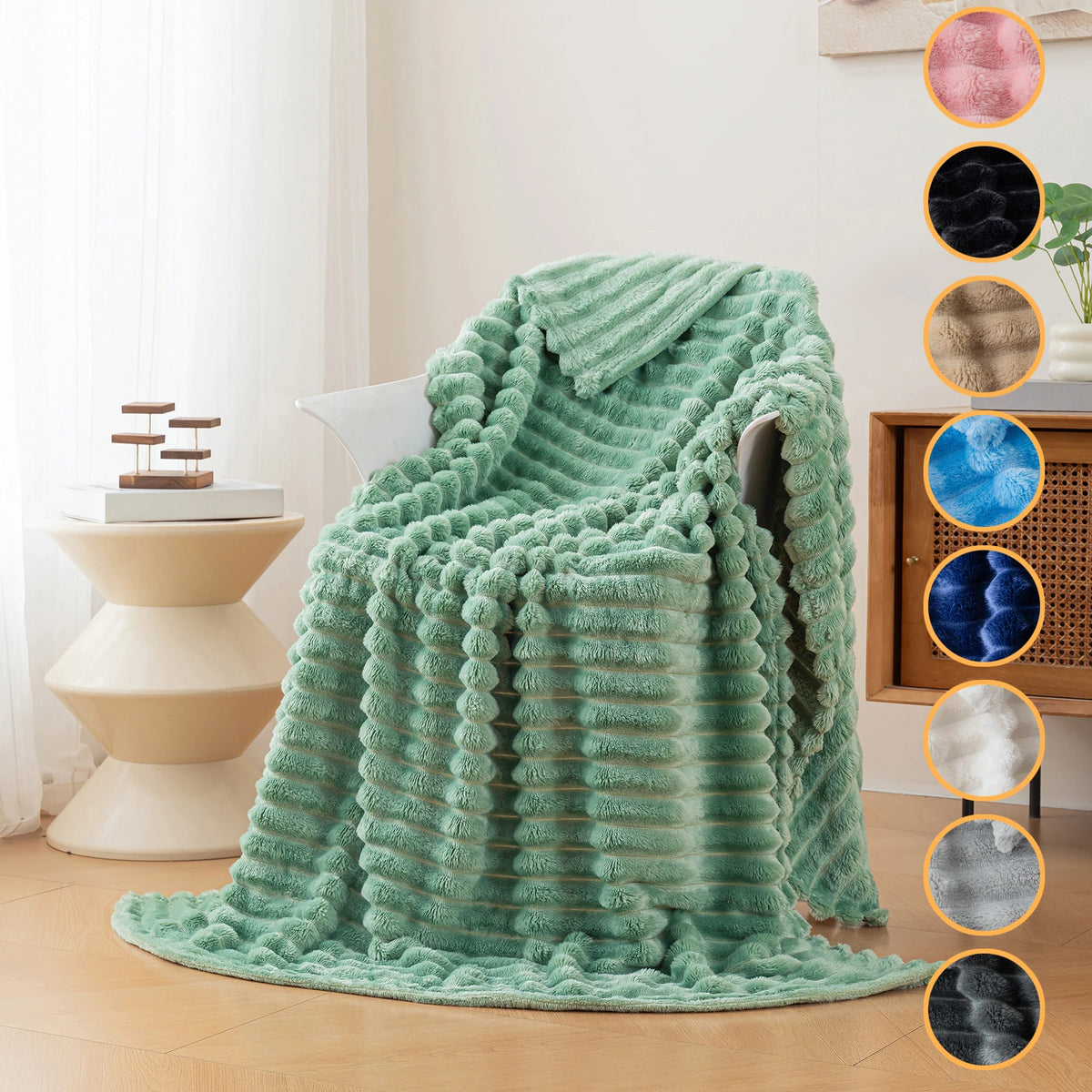 A teal soft flannel throw blanket draped over a chair in a bright room.