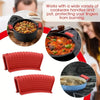 Red silicone pot handle covers protecting fingers from burning on cookware.