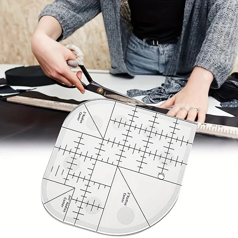 A hand is using an acrylic quilting ruler with corner templates on a sewing surface.