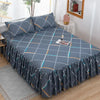 A set of three gray fitted bed sheets with an orange and white geometric pattern and elastic lace trim.
