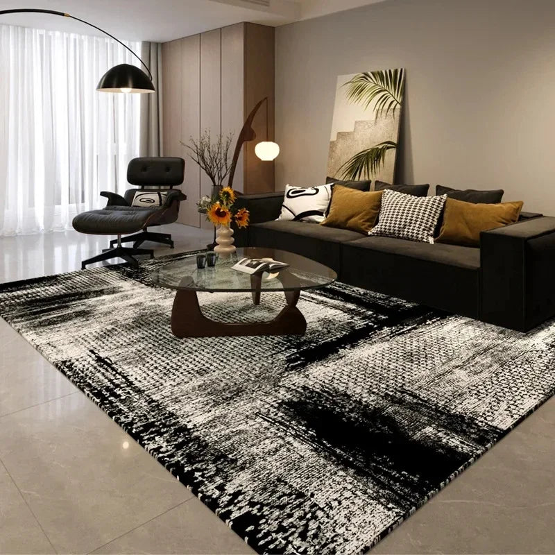 A black and white geometric non-slip area rug is displayed in a modern living room setting.