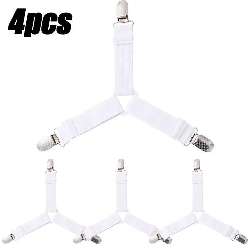 Four white adjustable bed sheet grippers with clips arranged in a V-shape.