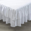 White two-layer ruffled crib bed skirt for a nursery
