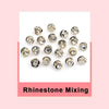 A collection of various rhinestone mixing jewelry pieces including brooches and buttons.