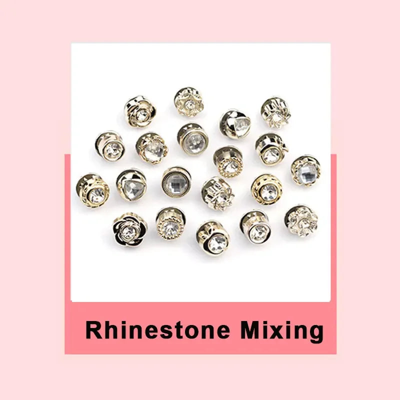 A collection of various rhinestone mixing jewelry pieces including brooches and buttons.