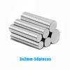 Fifty silver metallic magnetic fridge magnets measuring 3x2mm stacked together.