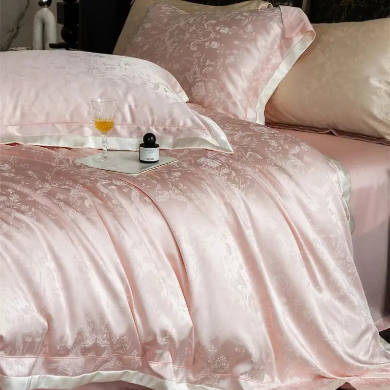 Pink luxury lyocell bedding set with floral pattern and matching pillows