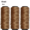 Three spools of khaki colored sewing thread for hair extensions