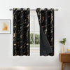 A pair of black blackout curtains featuring a golden wave pattern hanging in a window frame.