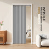 A gray foldable shower curtain hanging in a white door frame with an invisible hardware label.