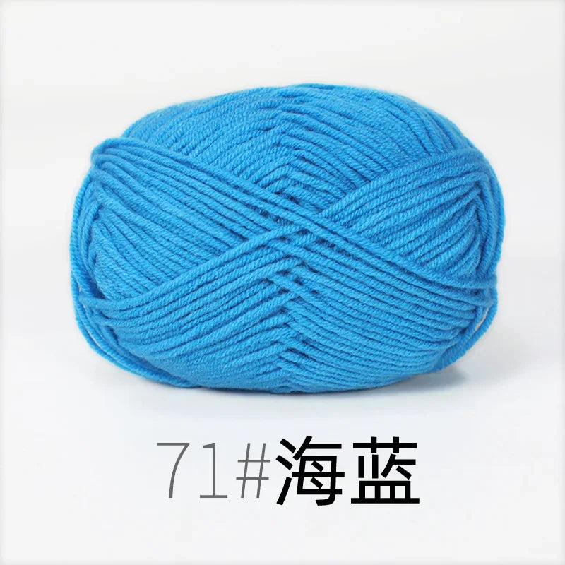 A ball of bright blue organic cotton 4ply knitting yarn.