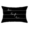 A black pillow cover with three horizontal white lines and the words love laugh live written on it.