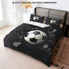 A soccer ball themed bedding set featuring a duvet cover and three pillowcases in black and gray.
