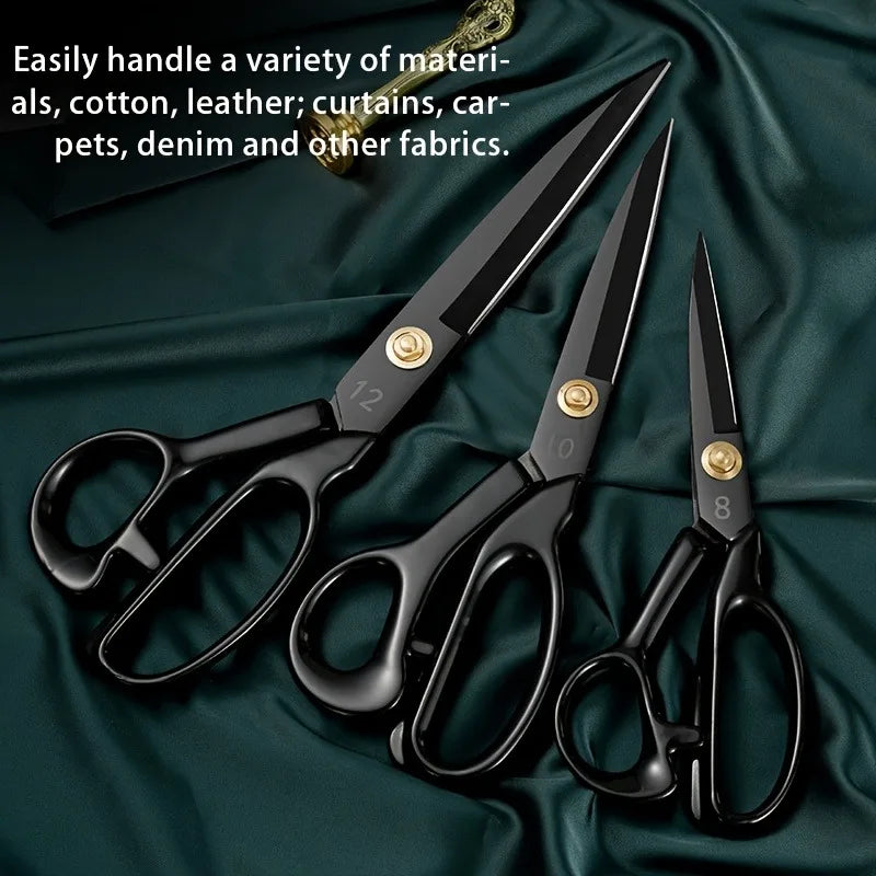 A set of heavy-duty carbon steel tailor scissors with black handles resting on a dark green fabric.