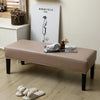 A beige waterproof stretch dining bench cover is displayed on a wooden bench with a minimalist drawing of a figure.