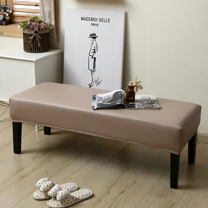 A beige waterproof stretch dining bench cover is displayed on a wooden bench with a minimalist drawing of a figure.