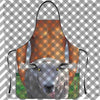 A close-up of a gray goat wearing an orange checkered apron.