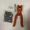 An orange precision snap button kit includes a pair of pliers and numerous small metal snap buttons.
