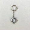 Silver heart-shaped pocket watch keychain with a round face and hands