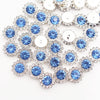 Silver and blue crystal rhinestone sew-on buttons arranged in a sunflower pattern