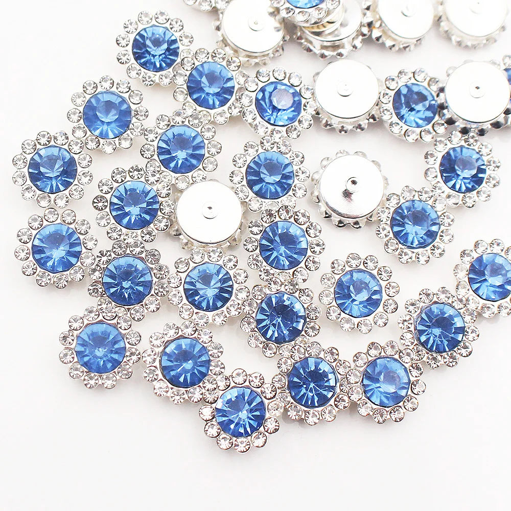 Silver and blue crystal rhinestone sew-on buttons arranged in a sunflower pattern
