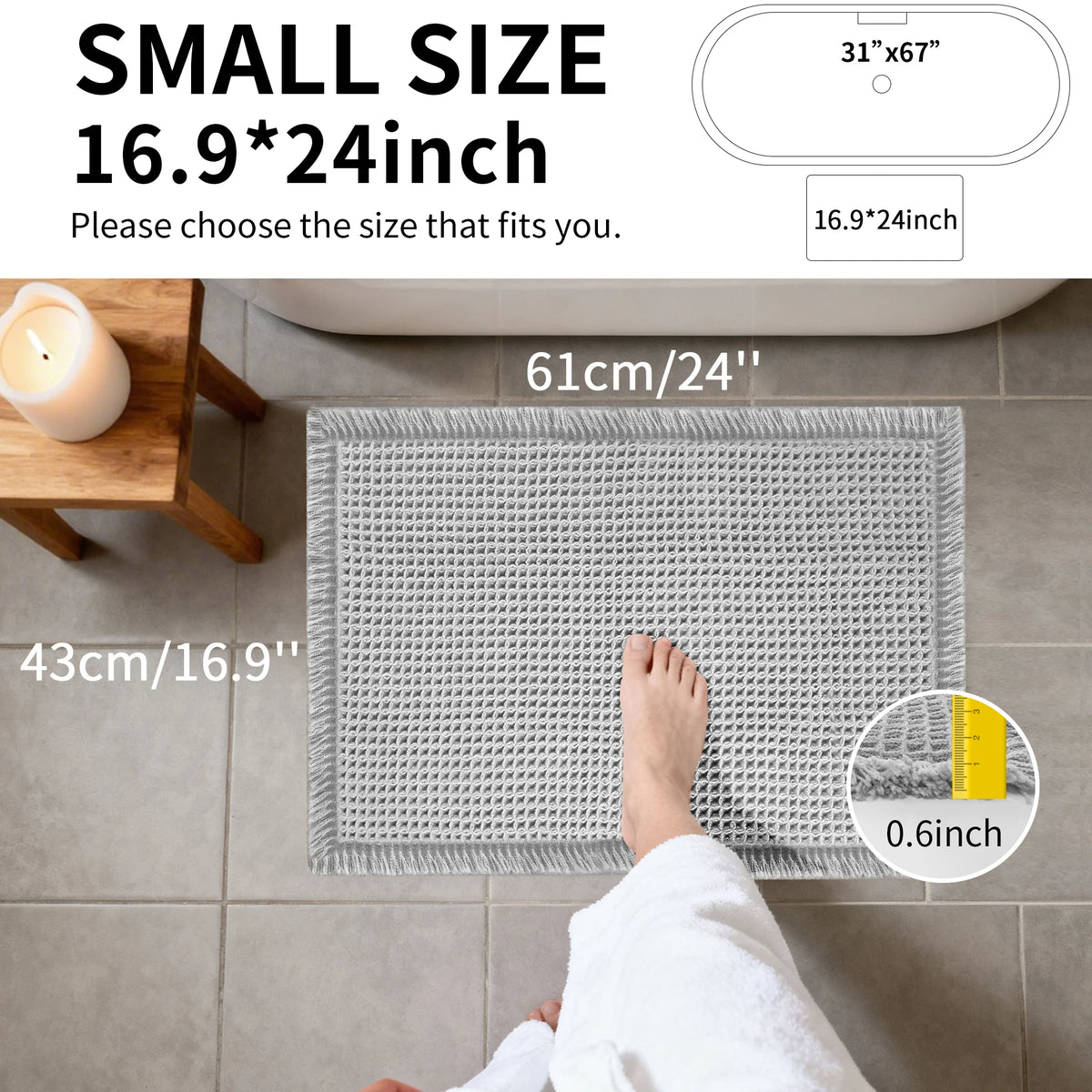 A gray waffle design non-slip bathroom mat is shown placed on a tiled floor, with a foot resting on it.