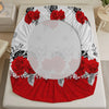 A red rose printed fitted mattress cover with a white background and black accents.