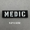Black embroidered patch with the word MEDIC in white text