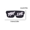 Black iron-on embroidery patch with the text THEY LIVE embroidered in white.