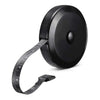 A close-up view of a black flexible body measuring tape with a black plastic casing and a black strap.