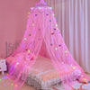 Pink decorative bed curtain mosquito net with butterfly embellishments draped over a bed