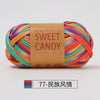 A ball of hand-dyed, multicolored striped yarn for crochet and knitting, packaged with a brown label.
