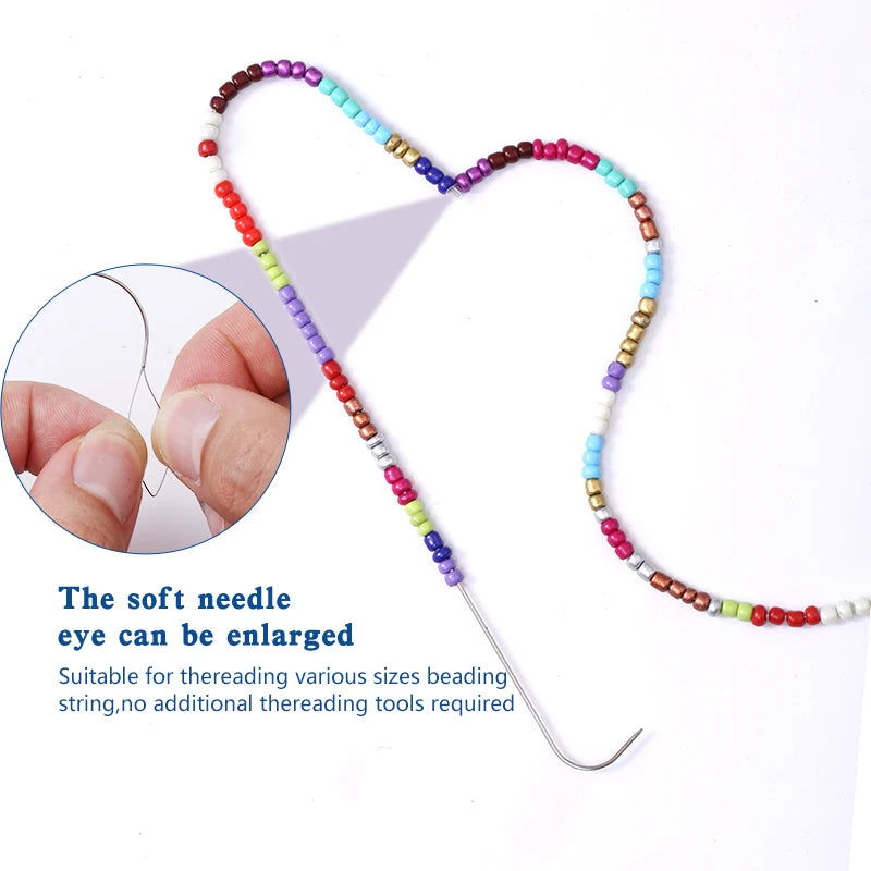A heart-shaped string of colorful beads is shown with a small needle for threading, suitable for DIY jewelry making.