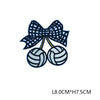 Navy blue iron-on embroidered letter patches shaped like a bow and two tennis balls