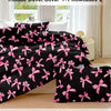 Black duvet cover set featuring a pink plaid bow print and two matching pillowcases.