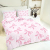 Pink bedding set featuring a butterfly pattern on a duvet cover and pillowcases.
